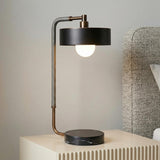 Amadeo Table Lamp 24", Black and Bronze woven globe Table Lamp in a Modern Bedroom with a fluted nightstand.