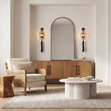 Umbria Wall Sconce 37", Bronze globe Wall Sconce in a Transitional Living Room with an arched mirror and wood sideboard.