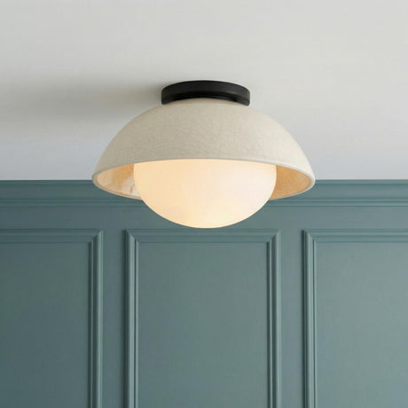 Hanley Flush Mount 12", Black and Ivory Crackle Ceramic globe Flush Mount in a Transitional Entryway with teal wood wall paneling.