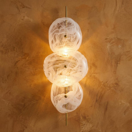 Malina Wall Sconce 30", Antique Brass and Art Glass globe Wall Sconce in a Contemporary Entryway with a textured plaster wall.