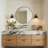 Cosette Matte Black and Brass geometric wall sconce in a Contemporary Bathroom with a white marble vanity.