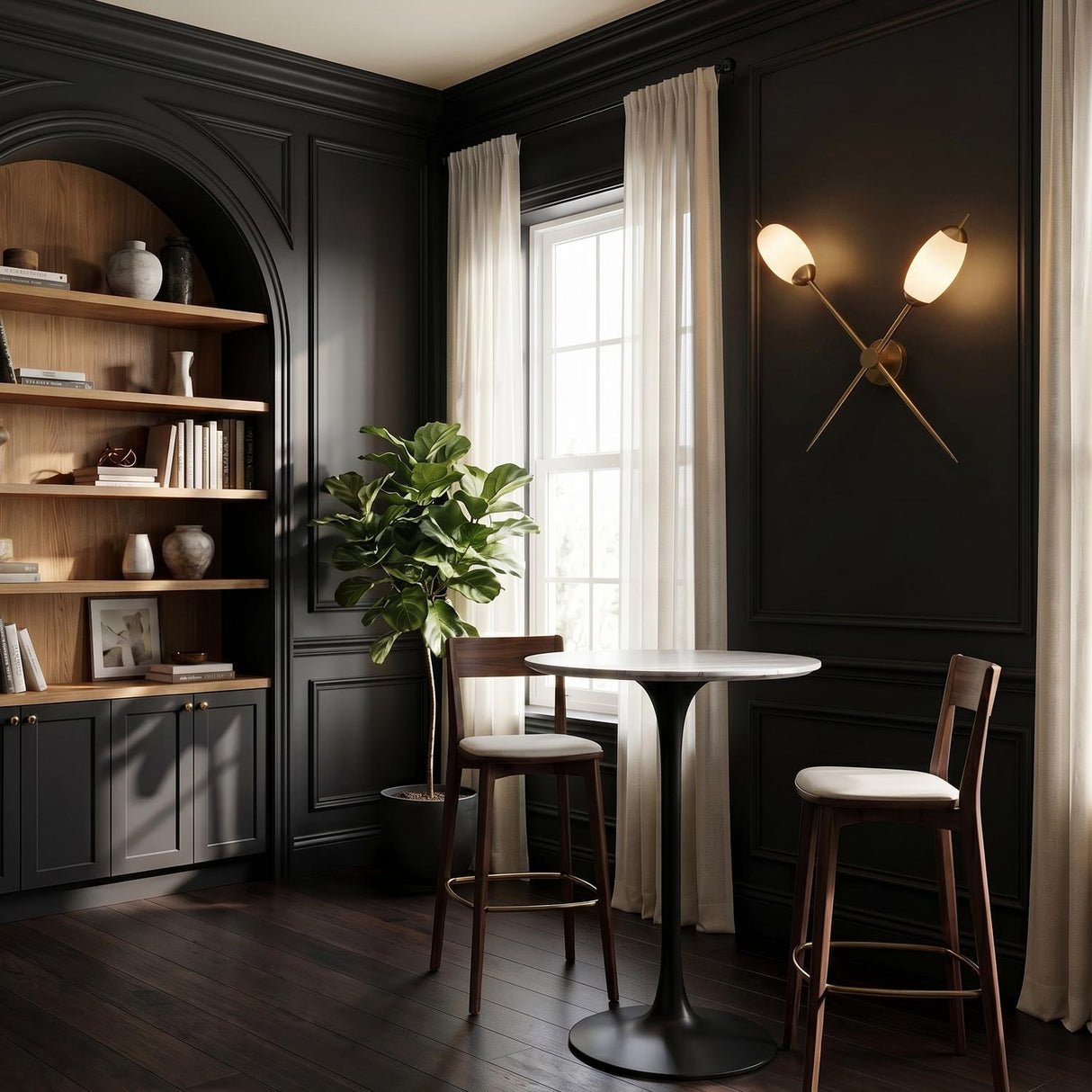 A traditional living room with the Vianna Adjustable Double Wall Sconce in antique brass and art glass mounted on dark paneled walls beside a marble-top bistro table.
