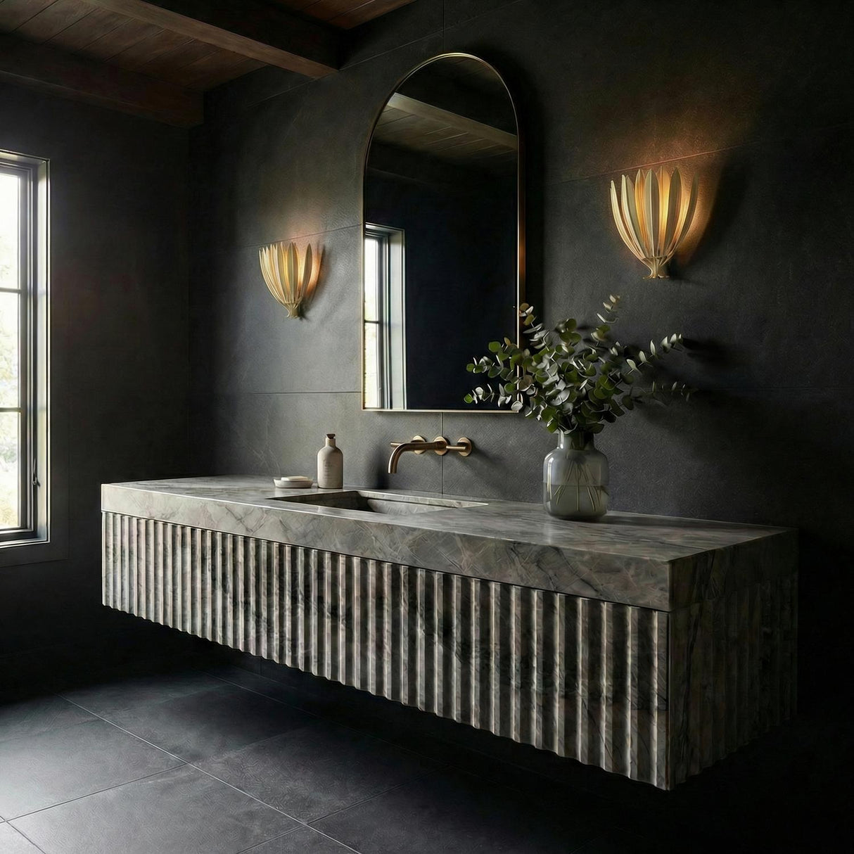 Yasmin Wall Sconce 13", Cream leaf design wall sconce in a Contemporary Bathroom with a fluted stone vanity and arched mirror.