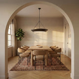 Dalina Extra Large Pendant 36", Aged Iron geometric pendant in a Transitional Dining Room with a light oak table and patterned rug.