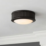 Bishop Extra Small LED Flush Mount 5", Aged Iron geometric flush mount in a Transitional Hallway with white crown molding.