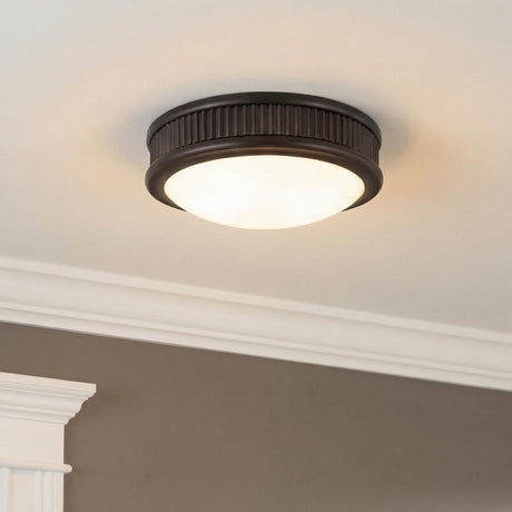 Bishop Small LED Flush Mount 8", Aged Iron geometric Flush Mount in a Traditional Entryway with white crown molding.