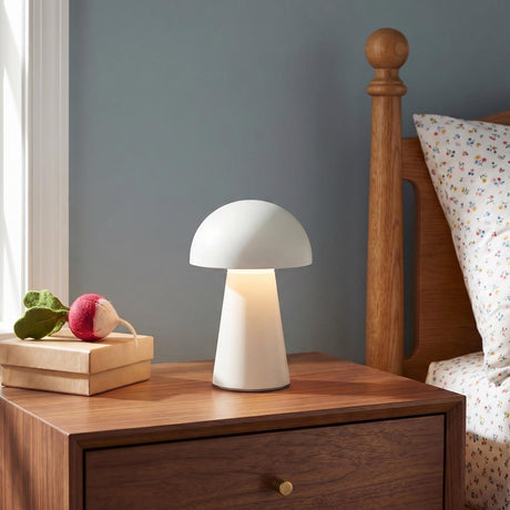 Marnie Rechargeable Table Lamp 9", White geometric Table Lamp in a Transitional Bedroom with a wood nightstand and floral bedding.