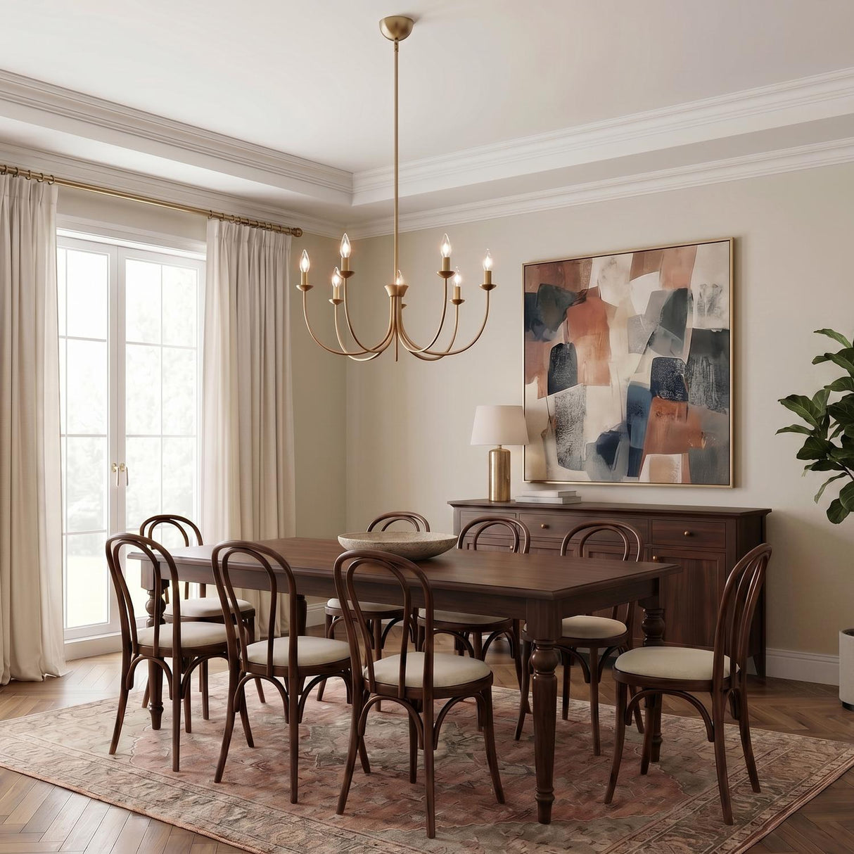 A transitional dining room with a brushed brass Channing 7 Light Chandelier 26" suspended over a dark wood table with Thonet-style chairs and herringbone wood flooring.