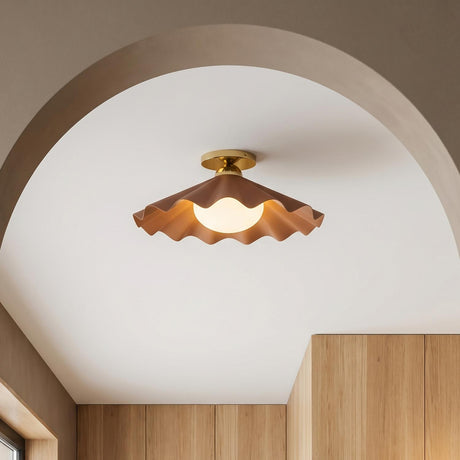A contemporary foyer with the Babette Medium Semi-Flush sixteen inch in blush and brass along the ceiling near an arched passage and light wood cabinetry.