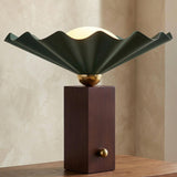 Babette Medium Table Lamp 14", Hunter Green and Walnut scalloped Table Lamp in a Contemporary Living Room with a textured plaster wall.