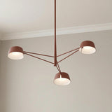 Jude LED 3 Light Chandelier 36", Paprika Matte geometric Chandelier in a Modern Living Room with neutral walls and crown molding.