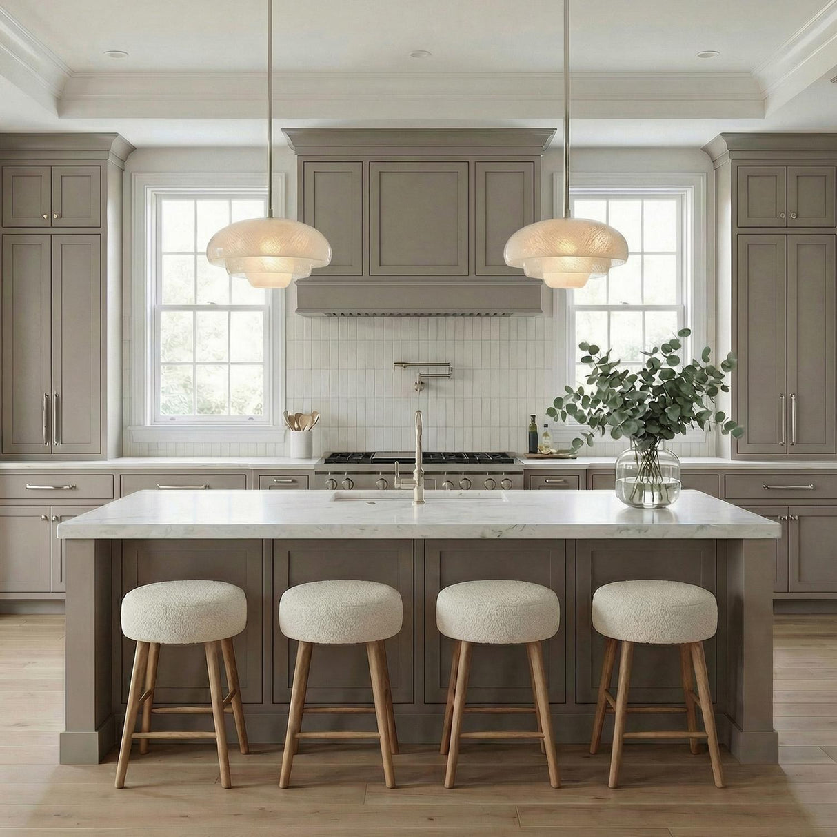 Jalina Pendant 18", Polished Nickel and Art Glass scalloped pendant in a Transitional Kitchen with a white marble island and boucle stools.