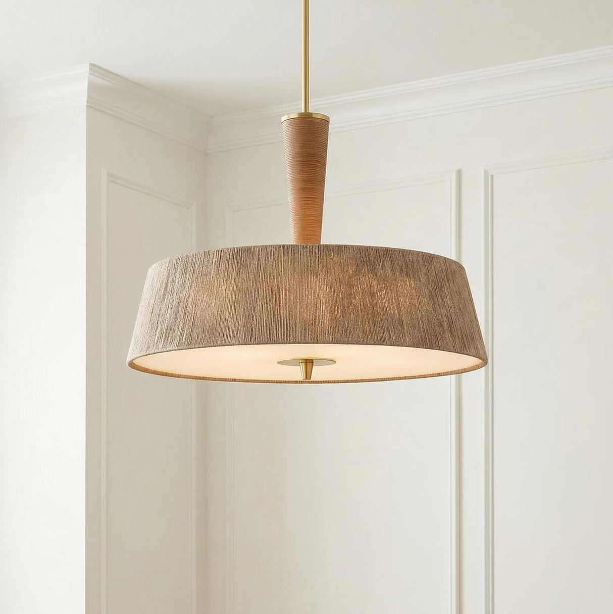 Pascal Extra Large Pendant 30", Jute, Rattan and Aged Brass woven Pendant in a Transitional Dining Room with white wall molding.
