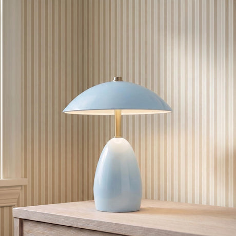 Aubrey Rechargeable Table Lamp 11", Baby Blue globe design Table Lamp in a Traditional Bedroom with striped wallpaper.