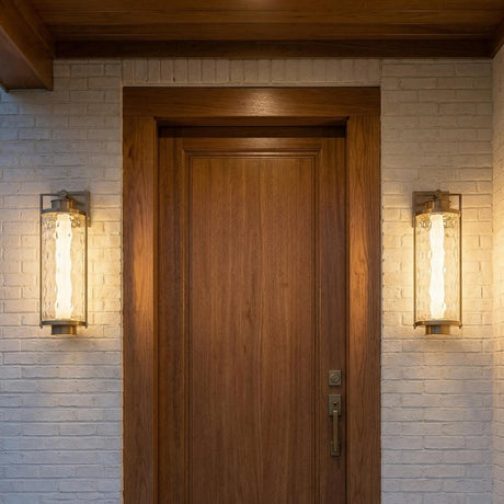 Catalina LED Outdoor Wall Light, Extra Large 28", Patina Brass linear Outdoor Wall in a Contemporary Outdoor with a wood door.