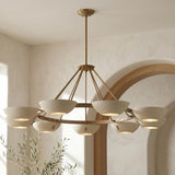 Clovis 9 Light Chandelier 55", Soft Sand and Patina Brass geometric Chandelier in a Mediterranean Dining Room with a wooden arched doorway.