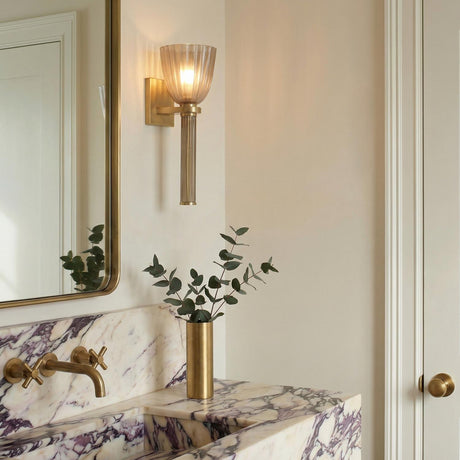 Sabel Wall Sconce 15", Aged Brass and Smoke Taupe Glass Aged Brass scalloped Wall Sconce in a Contemporary Bathroom with a marble vanity.