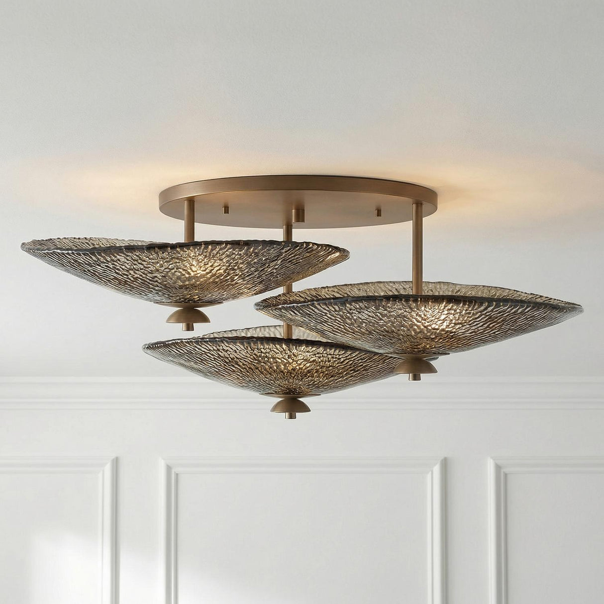 Azaria 3 Shade Semi-Flush 36", Bronze Piastra Glass scalloped flush mount in a Transitional Living Room with white wall paneling.