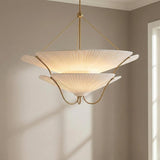 Marcelle Oversized Pendant 40", Aged Brass and Linen leaf design Pendant in a Transitional Dining Room with neutral walls.