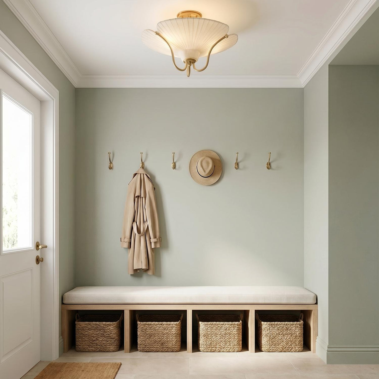 A transitional foyer with the Marcelle Semi-Flush 18", Aged Brass and Linen installed over a wood storage bench and sage green walls.