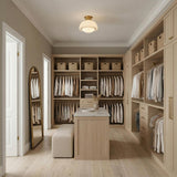 Leonie Small Semi-Flush 11", Aged Brass and Milk Glass globe flush mount in a Transitional Closet with a marble island and gold mirror.
