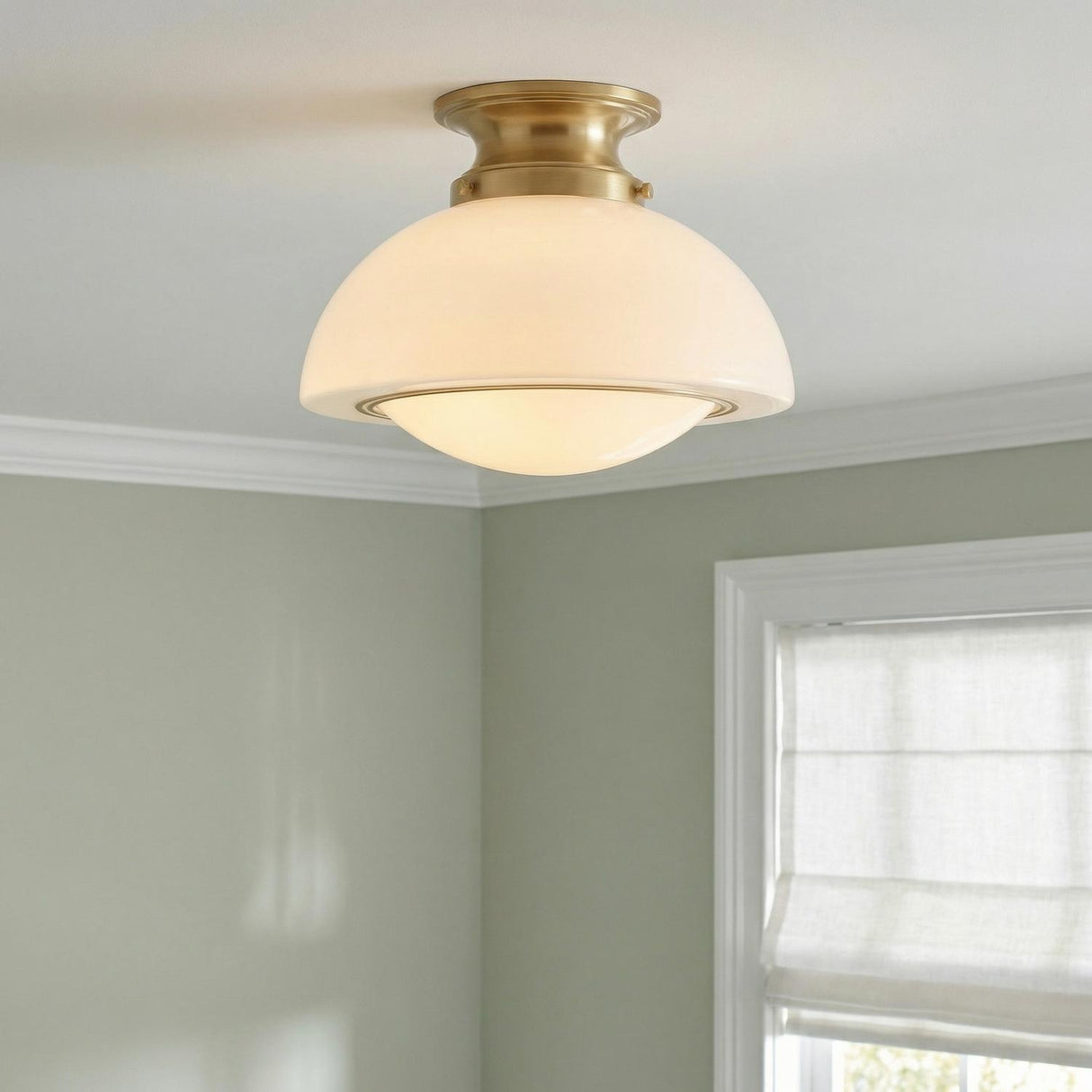 Leonie Small Semi-Flush 11", Aged Brass and Milk Glass globe Flush Mount in a Traditional Entryway with a white roman shade.