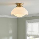 Leonie Small Semi-Flush 11", Aged Brass and Milk Glass globe Flush Mount in a Traditional Entryway with a white roman shade.
