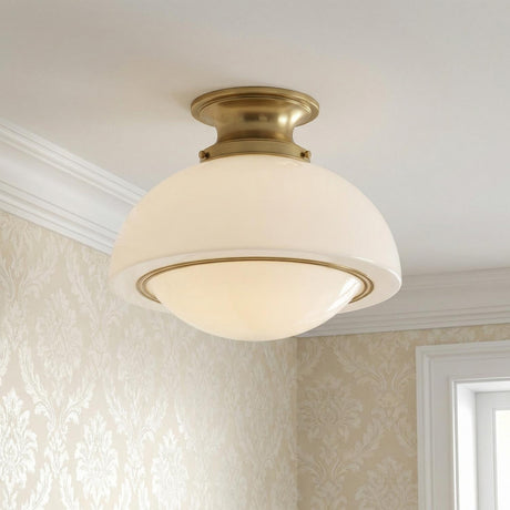 Leonie Medium Semi-Flush 15", Aged Brass and Milk Glass globe flush mount in a Traditional Hallway with damask wallpaper.