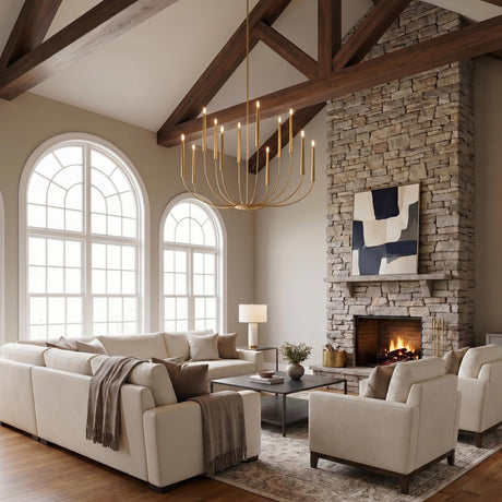 A modern farmhouse living room with the Solana 12 Light Chandelier 48-inch Modern Brass hanging from a vaulted beamed ceiling above a cream sectional and stone fireplace.
