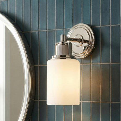 Claxton Wall Sconce 11", Polished Nickel geometric Wall Sconce in a Transitional Bathroom with teal subway tile and a round mirror.