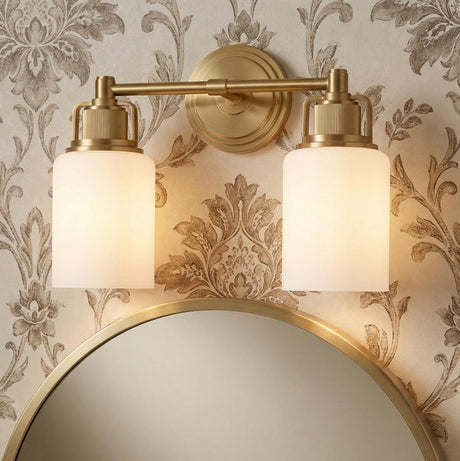 Claxton 2 Light Vanity 14", Modern Brass geometric Vanity in a Traditional Bathroom with damask wallpaper and round brass mirror.