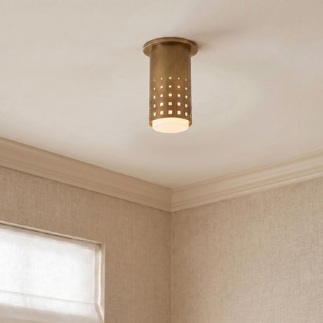 A transitional foyer with the Egan Cylinder Flush Mount 5", Vintage Brass along the ceiling above textured beige wallpaper and white crown molding near a window.