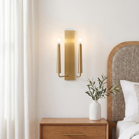 A modern bedroom featuring the Solana Double Wall Sconce 18", Modern Brass on a white wall above a wooden nightstand and a linen-upholstered oak headboard.