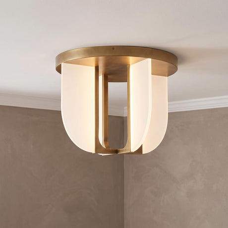 A modern foyer with a Dagan LED Flush Mount 17", Vintage Brass along the ceiling center featuring white glass panels and textured plaster walls.