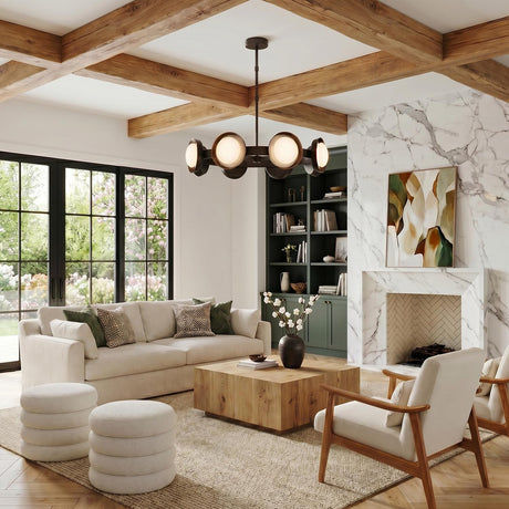 A modern living room with the Osmund LED Chandelier in urban bronze and frosted glass shades suspended from a beamed ceiling over a square wood coffee table.