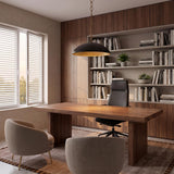 A mid-century office with the Charlie Pendant 28", Matte Black and Brushed Brass hanging over a walnut executive desk and built-in wood shelving filled with books.
