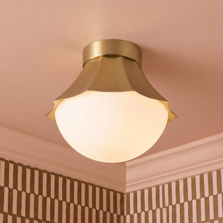 A transitional foyer with a Brex Semi-Flush 12 inch brushed brass and opal glass semi-flush mount on a pink ceiling with patterned geometric wallpaper and molding.