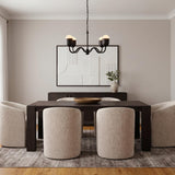 A contemporary dining room with the Rubina 4 Light Chandelier 27", Matte Black featuring matte black arms and frosted glass over a dark wood table with textured chairs.