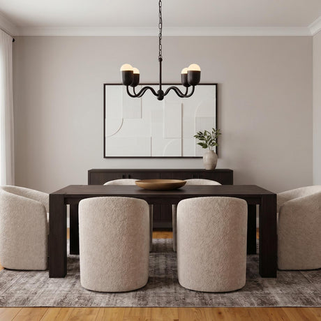 A contemporary dining room with the Rubina 4 Light Chandelier 27", Matte Black featuring matte black arms and frosted glass over a dark wood table with textured chairs.