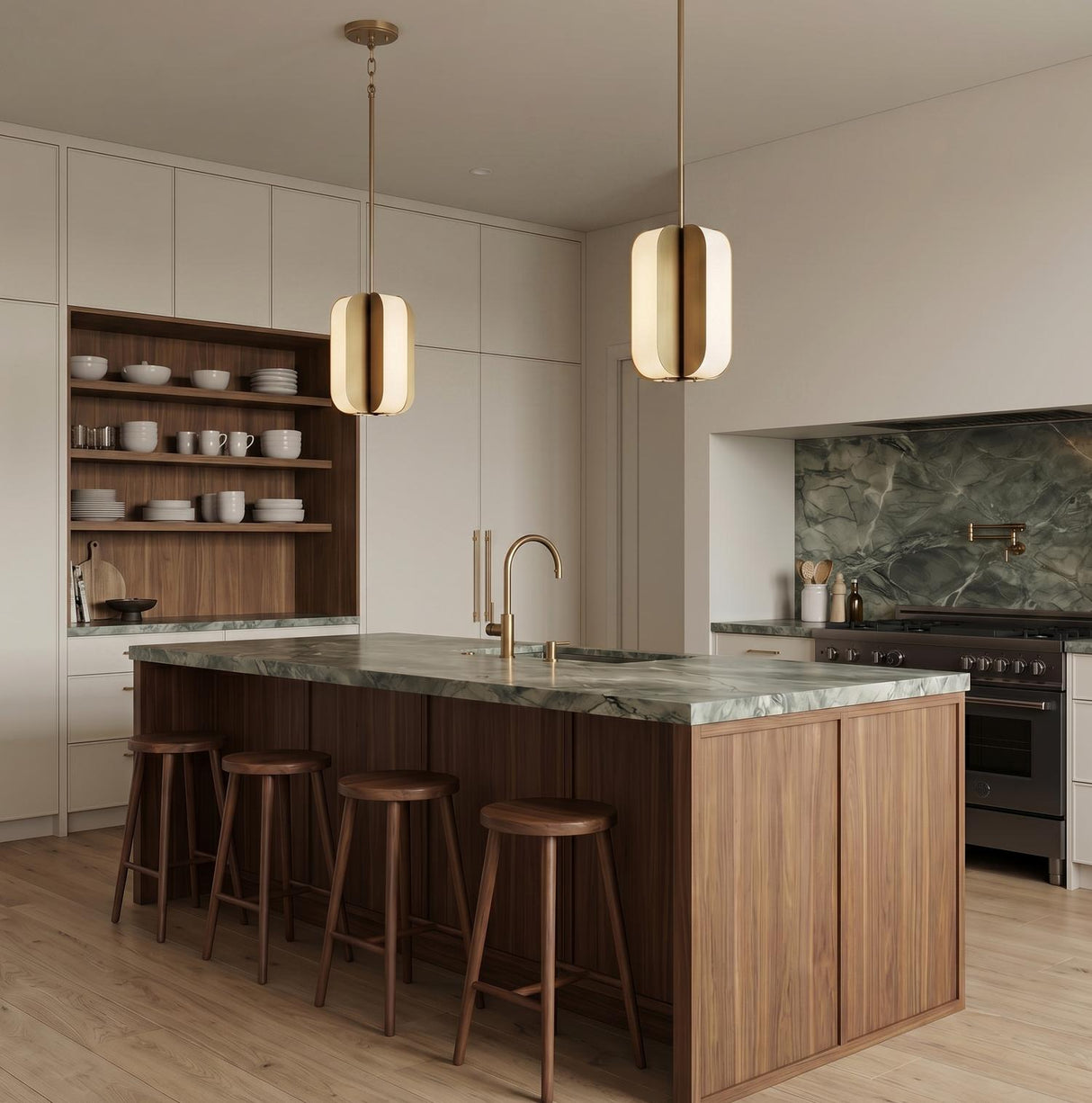 A modern kitchen with two Cian LED Pendant 12" fixtures in aged brass and milk glass over a walnut island and green marble countertop with white cabinets.