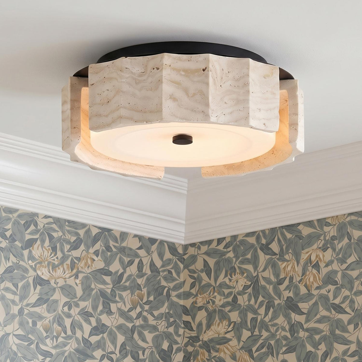 A contemporary foyer with the Damari Small LED Flush Mount 12", Travertine and Matte Black on a white ceiling with crown molding and blue floral wallpaper.