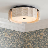 A contemporary foyer with the Damari Small LED Flush Mount 12", Travertine and Matte Black on a white ceiling with crown molding and blue floral wallpaper.