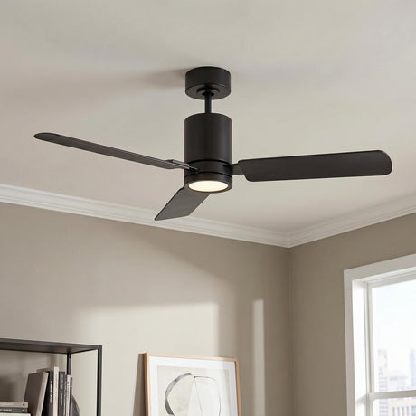 A modern living room with a matte black Corvo LED Ceiling Fan 54" mounted to the ceiling center above beige walls and a black metal bookshelf.