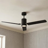 A modern living room with the Corvo LED Ceiling Fan 62 in Matte Black and frosted glass installed along the ceiling center above textured gray wallpaper.