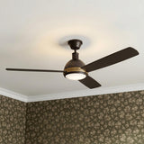A transitional bedroom featuring the Brant LED Ceiling Fan 60 inch in urban bronze and antique brass finishes centered on a white ceiling with floral patterned wallpaper.