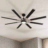 A modern living room with a Loon LED Ceiling Fan 72 inch in matte black and brushed steel finish mounted to the ceiling center above industrial concrete walls.