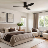 A contemporary bedroom with the Avocet LED Ceiling Fan in matte black oak mounted to the center ceiling above neutral bedding and cream bouclé chairs.
