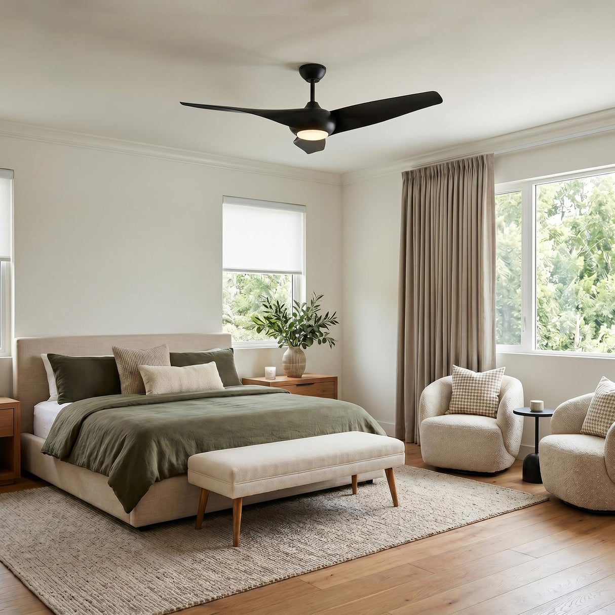 A contemporary bedroom featuring the matte black Krestel LED Ceiling Fan 52-inch centered on the ceiling above a beige upholstered bed with olive green bedding.