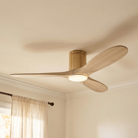 A transitional bedroom featuring the Eider LED Ceiling Fan with whitewash oak blades and modern brass finish mounted near sheer linen curtains and crown molding.
