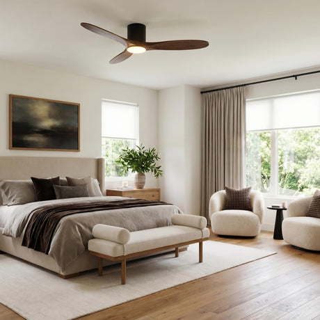 A contemporary bedroom with an Eider LED Ceiling Fan in walnut wood and matte black on the ceiling center over a beige upholstered bed.